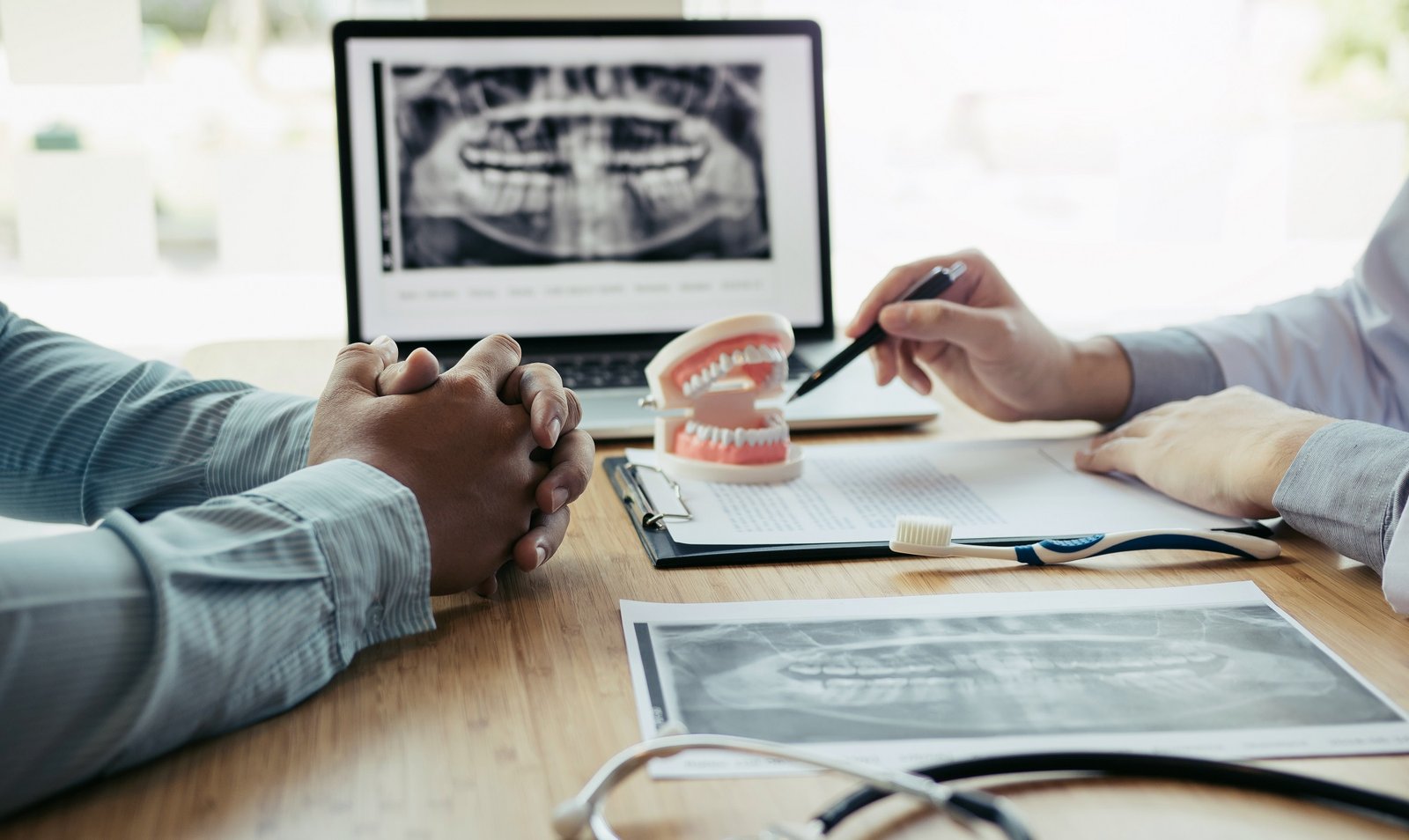 Dental treatment in Turkey consultation with patient and X-ray analysis