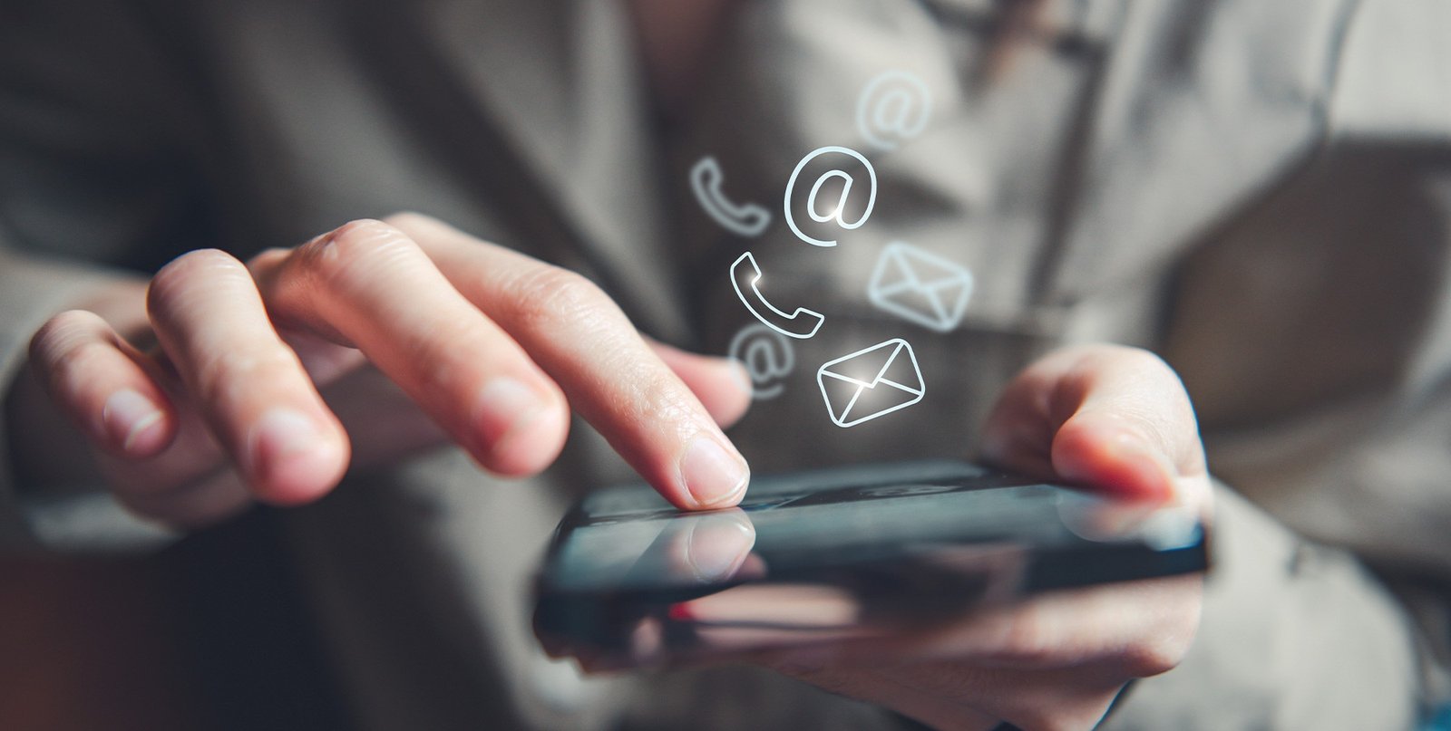 Hand holding phone with contact icons for Turkey Teeth dental services